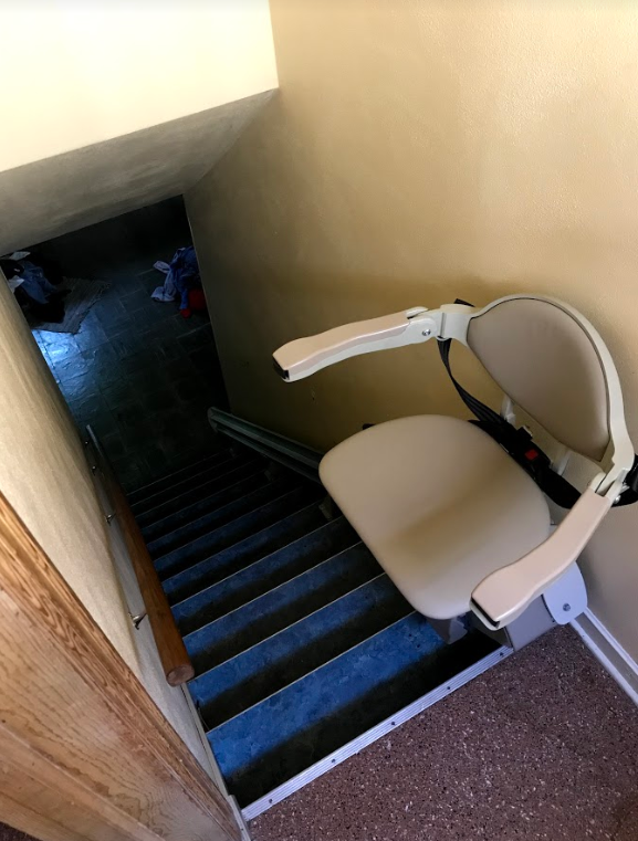 Bruno Elan stairlift at top landing of staircase in Minneapolis home