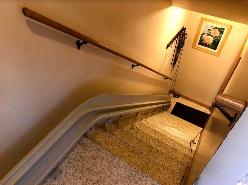 Bruno curved rail mounted on staircase in home in Minnesota