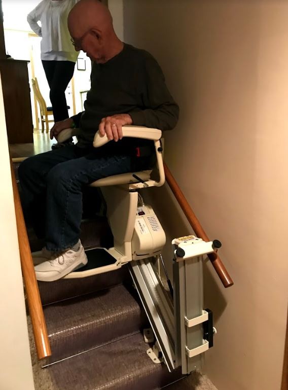 Lifeway Mobility Minneapolis customer rides new Harmar SL600 stair lift equipped with power folding rail