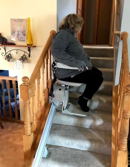 Lifeway Mobility Minnesota customer riding her new stairlift for the 1st time