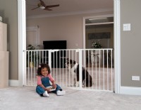 Child in front of Baby Gate