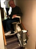Lifeway Mobility Minneapolis customer rides new Harmar SL600 stair lift equipped with power folding rail