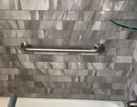 polished-grab-bar-installed-horizontally-in-bath-tub-in-Minnesota-home.JPG