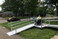 powerchair user takes his first down ride his new aluminum wheelchair ramp
