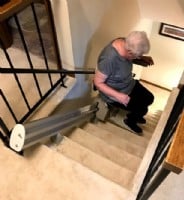 woman riding new stairlift in Minnesota