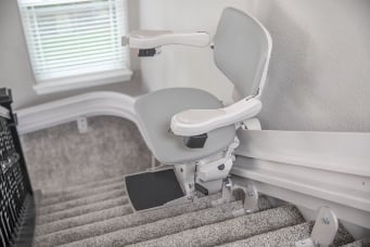 Bruno Elite Curved Stairlift with Gray Upholstery