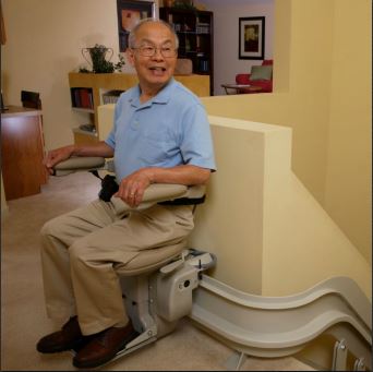 Man-riding-Bruno-Elite-curved-rail-stairlift