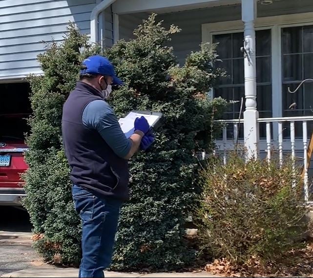 Lifeway Mobility consultant writing up ramp quote outside of home