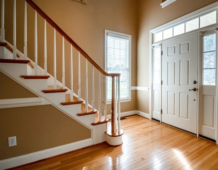 foyer of a home near stairs that lead up to bedrooms