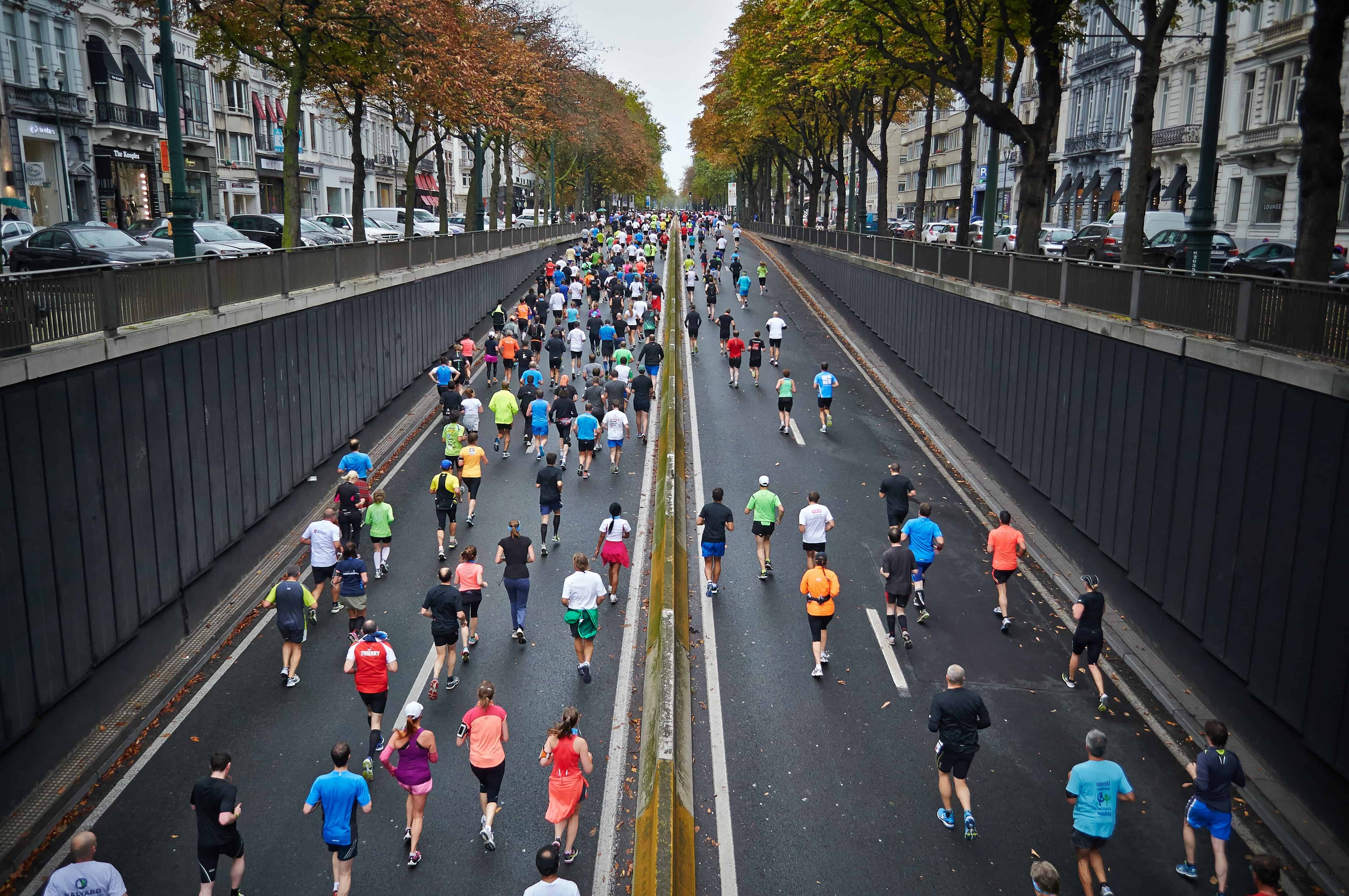 marathon runners running down street in California