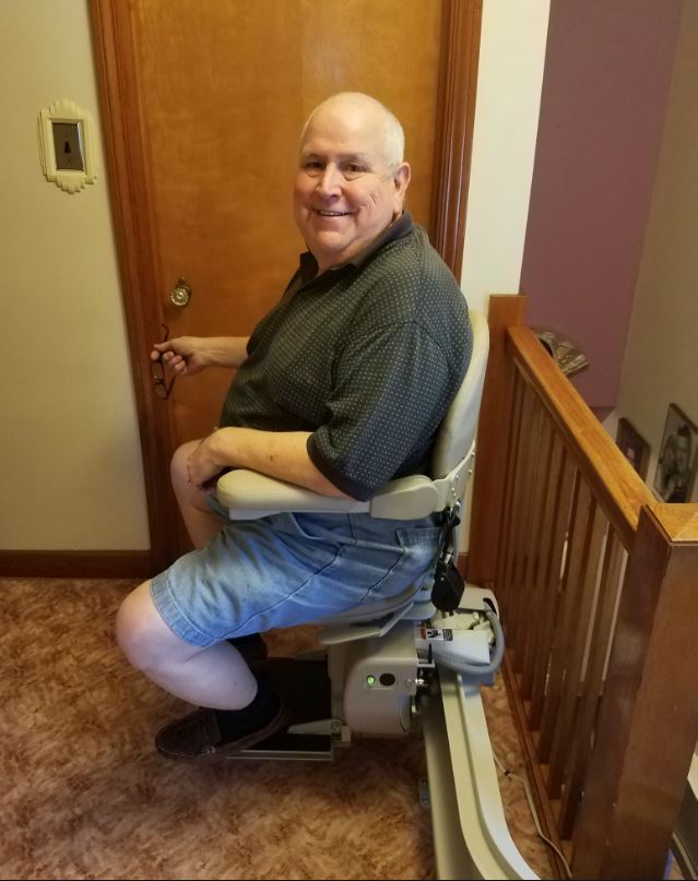 veteran riding his new stair lift funded by VA & installed by Lifeway Mobility