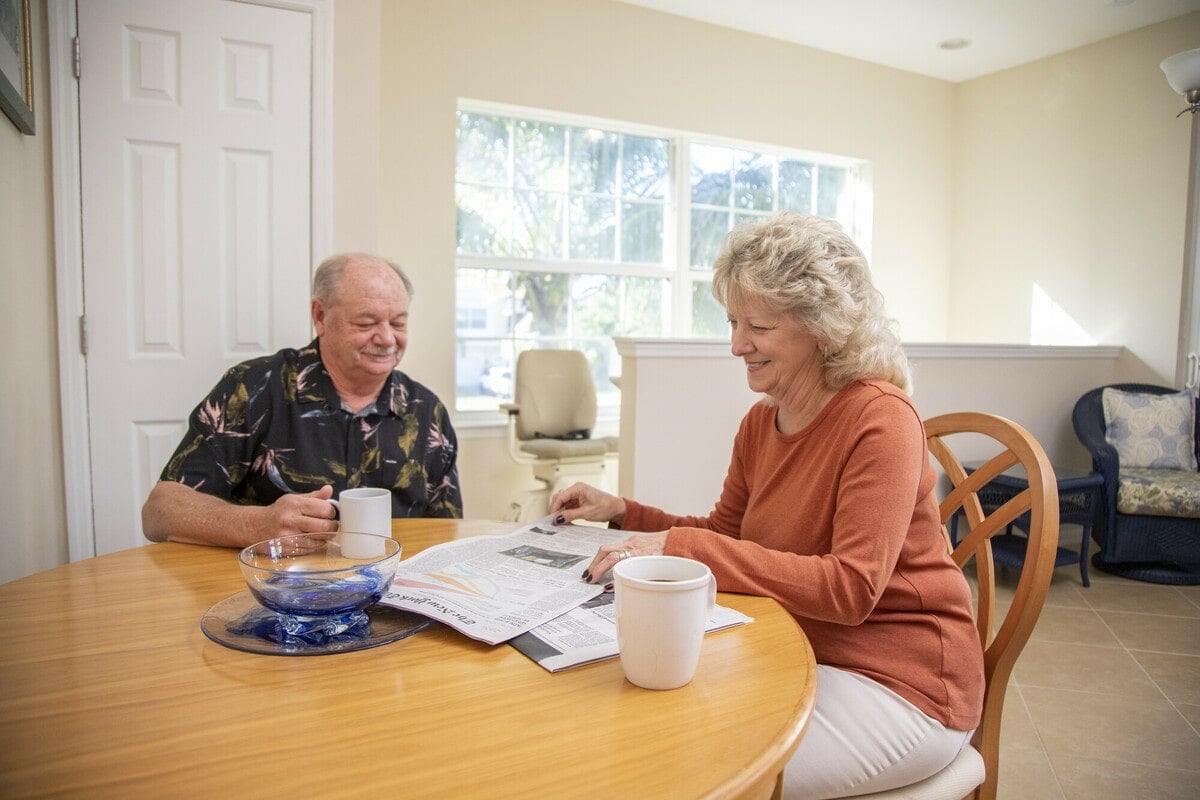 Couple discussing stair lift installation from Lifeway Mobility