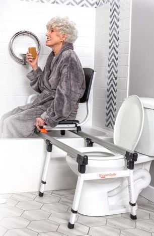 woman uses SolutionsBased shower transfer chair to safely enter bathtub