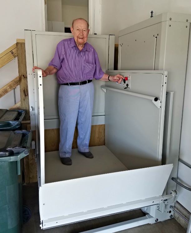 U.S. veteran standing on his newly installed wheelchair lift from Lifeway Mobility