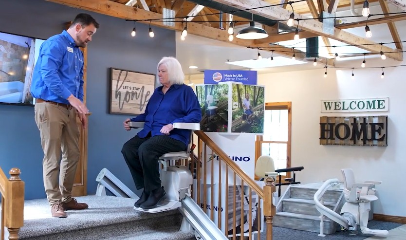 Lifeway Mobility consultant shows customer stair lifts in local showroom