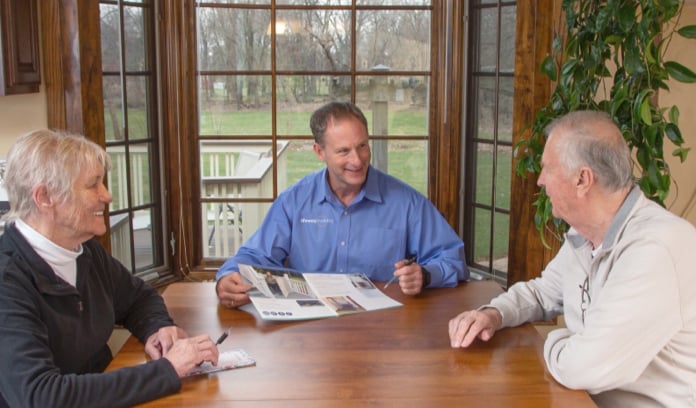 stair lift expert from Lifeway Mobility discussing stair lifts with customers