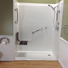 barrier free shower with bench and grab bars