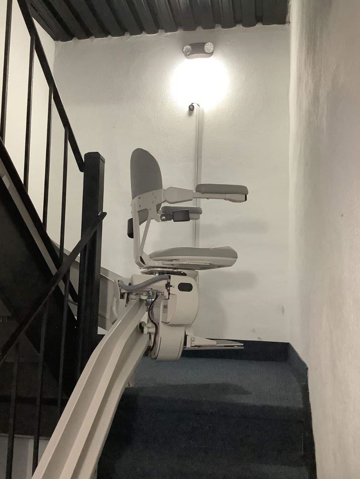 curved stair lift in condo unit in Ocean City, MD installed by Lifeway Mobility