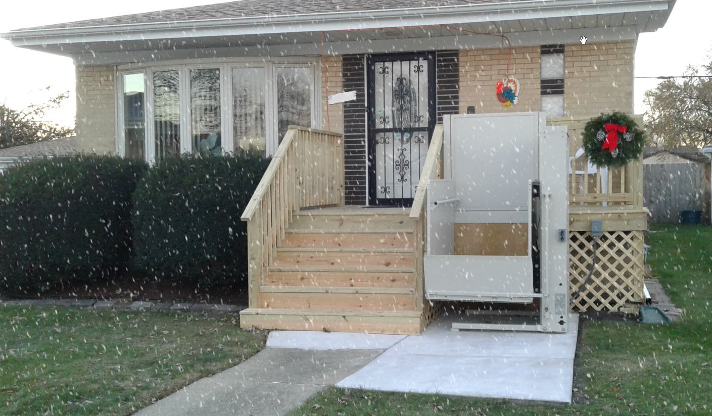 wheelchair porch lift installed in winter snow in Chicago, IL