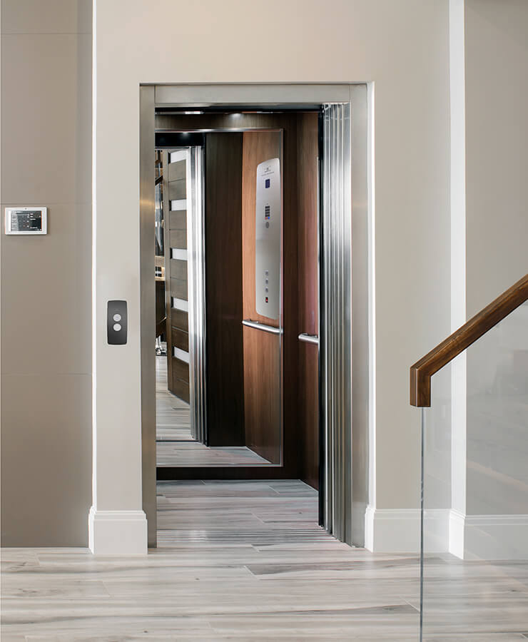 Garaventa Elvoron home elevator with mirror finish in cab