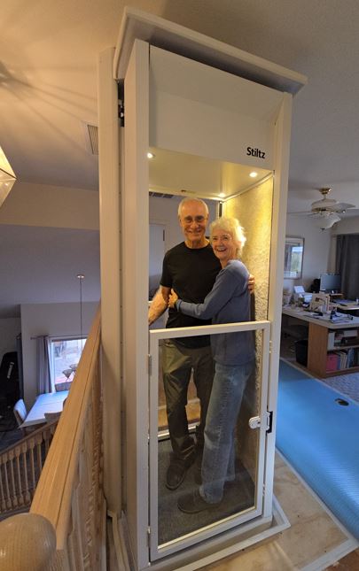 Senior couple ride in new elevator from Lifeway Mobility