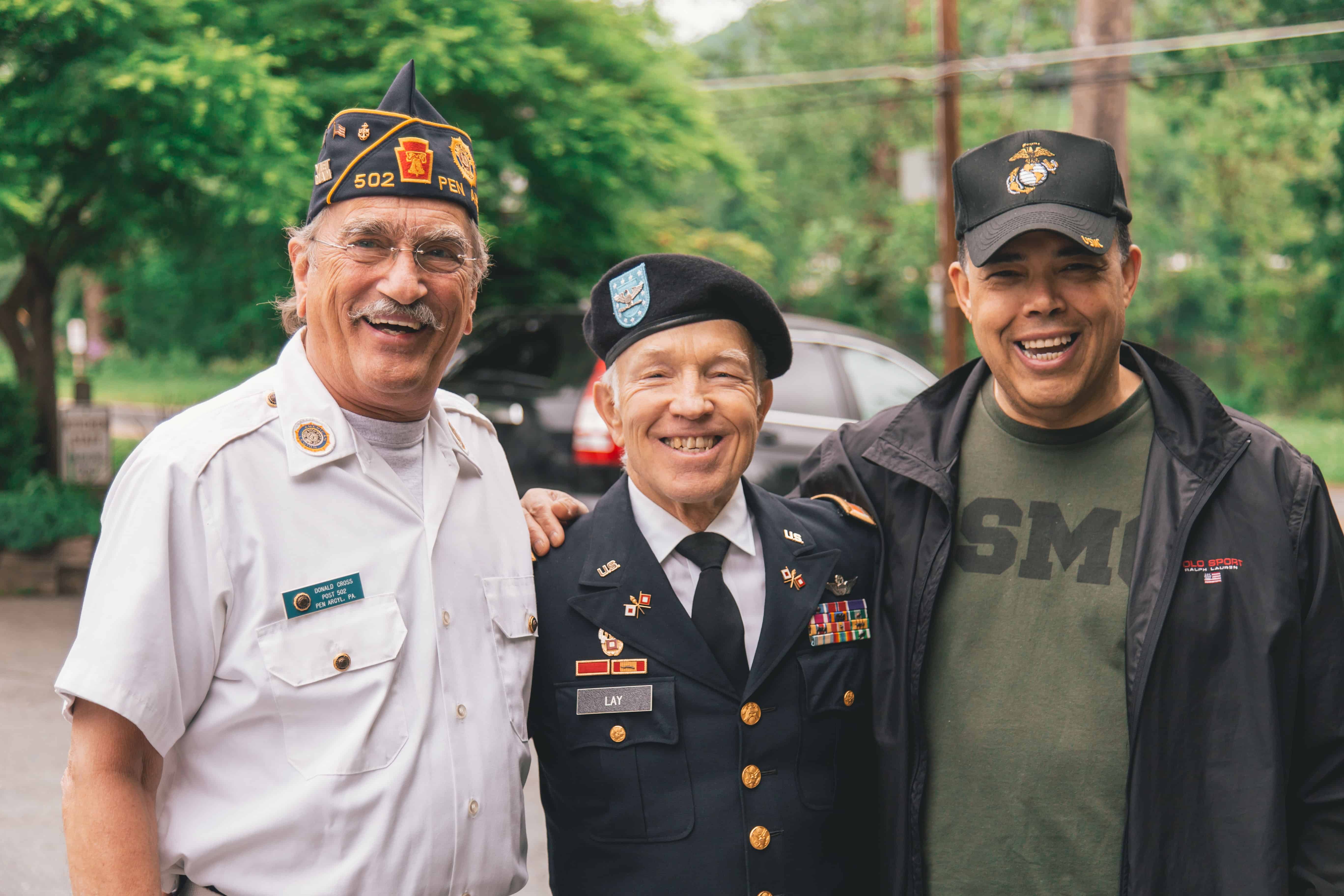U.S. veterans from multiple generations smiling together