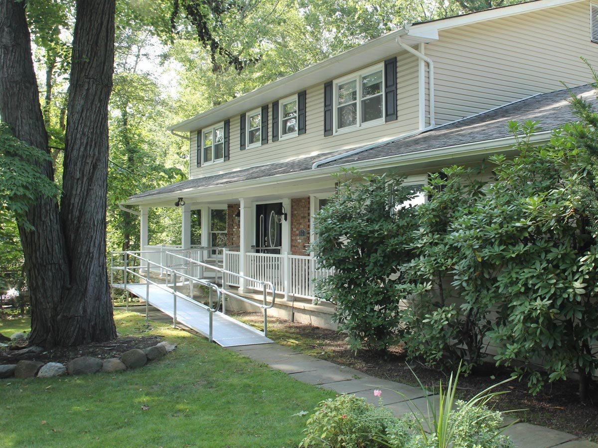 aluminum wheelchair ramp to provide access to front door entrance of home