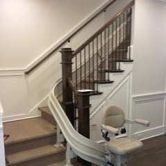 stair lift installed on L-shaped staircase