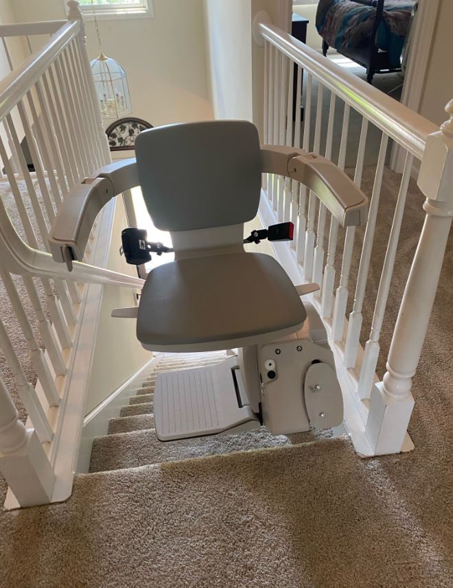 stairlift swiveled at top of staircase for safe exit from chair