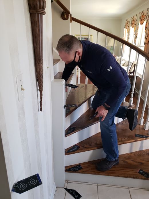 curved stairlift installation photo measurement by Lifeway Mobility consultant