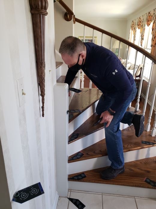 curved stairlift installation photo measurement by Lifeway Mobility consultant