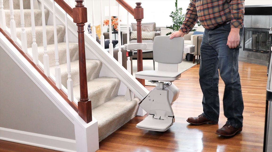 Lifeway Mobility Bruno Elan man standing with hand on backrest 