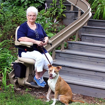 Woman and Dog with Bruno Elite Outdoor Stair Lift