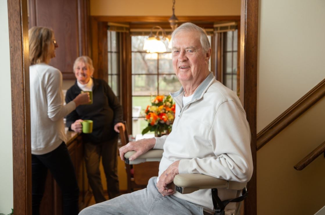 Lifeway Mobility customer smiling after installation of stairlift