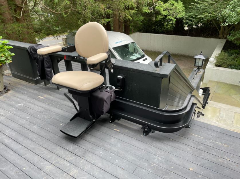 outdoor curved rail stairlift with black painted rail installed in MA by Lifeway Mobility