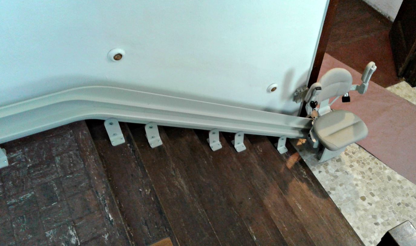 curved Bruno Elite stair lift at bottom of staircase in church in Chicago