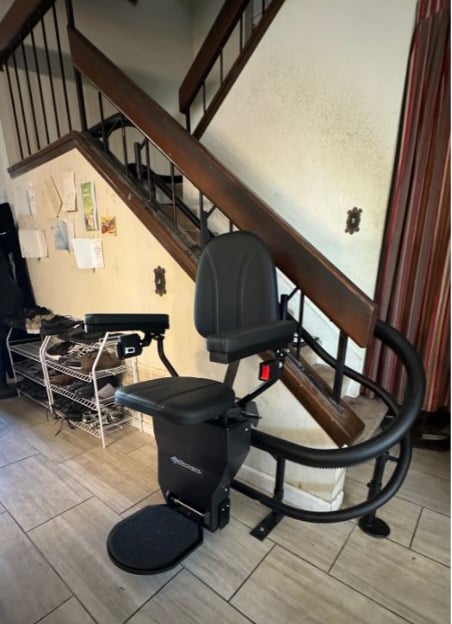 custom curved stair lift by Lifeway Mobility with custom black upholstery 