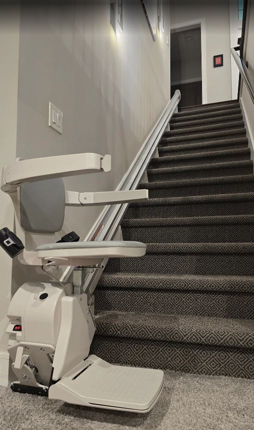 straight rail stair lift attached on the stairs