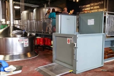 commercial wheelchair vertical platform lift installed by Lifeway Mobility at brewing company