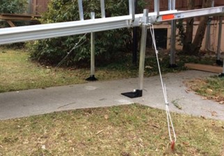 aluminum wheelchair ramp with hurricane straps installed by Lifeway Mobility