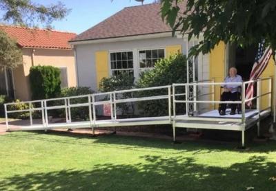 man on Lifeway Mobility wheelchair ramp