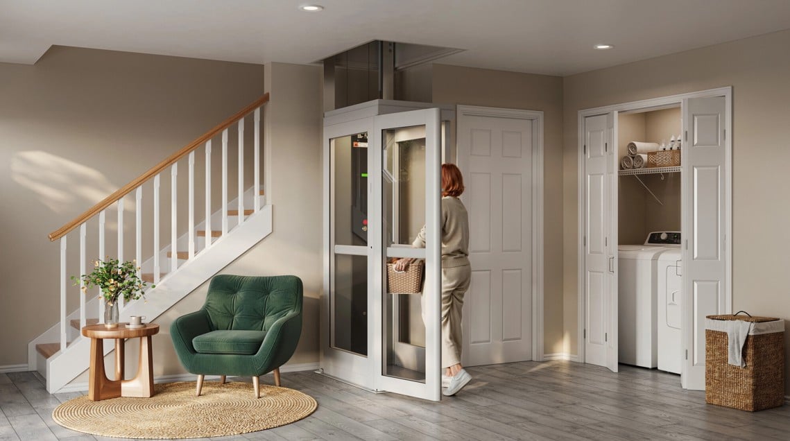 woman carrying laundry basket into through-floor home lift from Lifeway Mobility