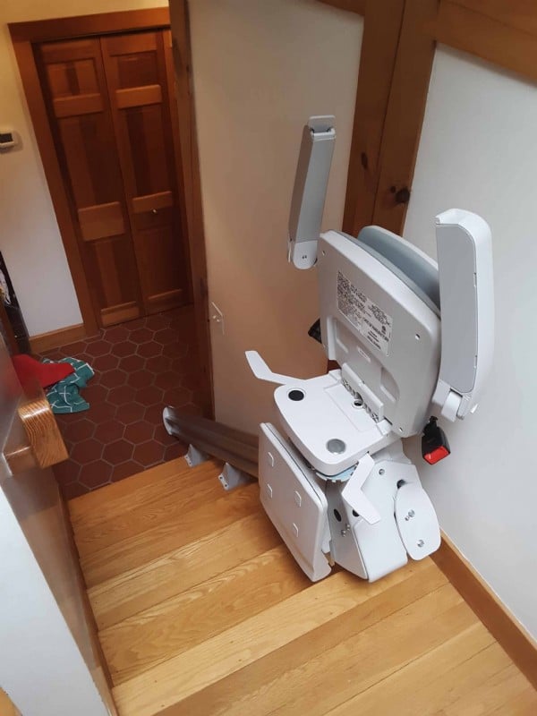 Bruno-Elan-stairlift-components-folded-up-at-top-landing-in-home-in-Weston-Massachusetts.jpg
