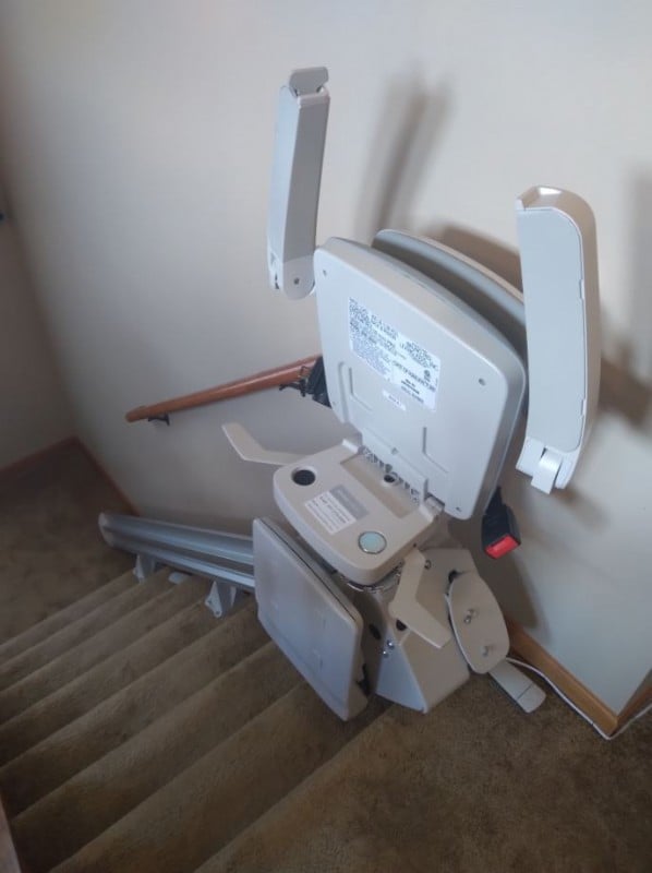 Bruno-Elan-stairlift-with-components-folded-up-at-top-landing-in-Wintrhop-Harbor-IL.JPG