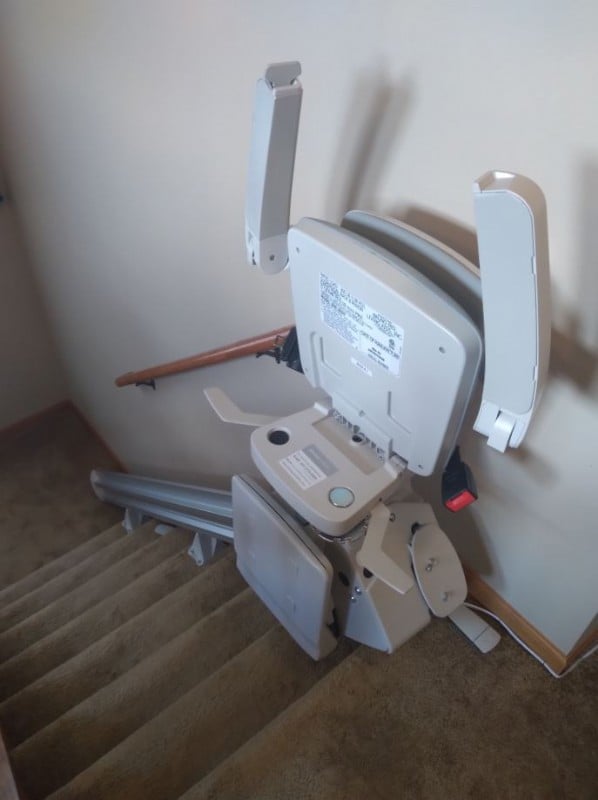 Bruno Elan stairlift with components folded up at top landing in Wintrhop Harbor IL