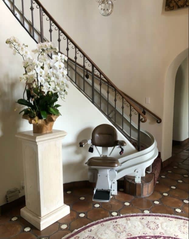 Bruno-Elite-curved-stairlift-with-brown-upholstery-installed-in-home-in-Los-Angeles.JPG