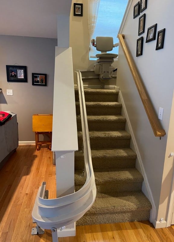 Bruno-curved-stairlift-with-chair-at-middle-of-staircase-bottom-view-Lifeway-Mobility-Baltimore.JPG