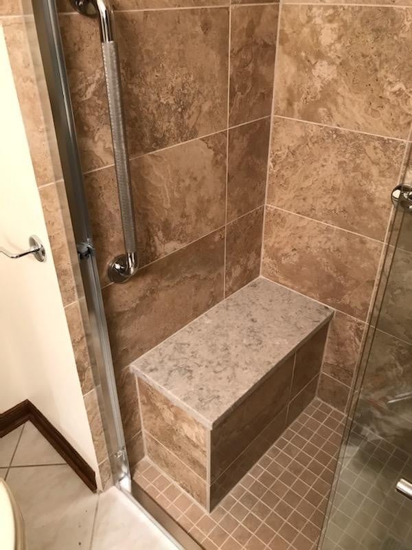 beautiful-shower-with-built-in-bench-and-grab-bars.jpg
