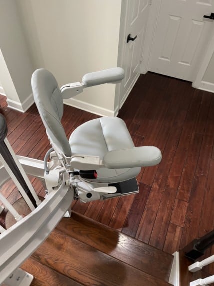 curved-stairift-at-bottom-landing-of-stairs-in-Clarksburg-Maryland.jpg