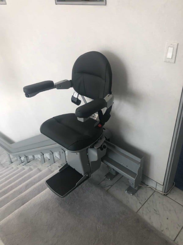 custom Bruno stairlift with black upholstery and gray painted rail in San Francisco